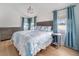 Serene bedroom featuring coastal-themed bedding, elegant side tables, and soft natural light, creating a tranquil retreat at 108 5Th Ave, St Pete Beach, FL 33706