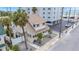 Aerial view of white single-Gathering home in a beach community near beach access and parking at 108 5Th Ave, St Pete Beach, FL 33706