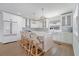 Kitchen features a large island with seating, lovely pendant lights, and stainless steel appliances at 108 5Th Ave, St Pete Beach, FL 33706