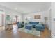 Bright living room boasts stylish decor, wood floors, and an open floor plan perfect for entertaining at 108 5Th Ave, St Pete Beach, FL 33706