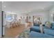Bright living room boasts stylish decor, wood floors, and an open floor plan perfect for entertaining at 108 5Th Ave, St Pete Beach, FL 33706