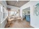 Cozy sitting area with wood-planked ceiling, lots of windows, and views into the living room at 108 5Th Ave, St Pete Beach, FL 33706