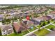 Aerial view of a two-story home with solar panels and a small backyard pool at 11024 Purple Martin Blvd, Riverview, FL 33579