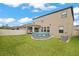 An expansive backyard featuring an above ground swimming pool and a cozy covered patio at 11024 Purple Martin Blvd, Riverview, FL 33579