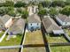 A backyard featuring a patio with outdoor furniture, a fire pit, and a well-maintained lawn with a fence at 11438 Ivy Flower Loop, Riverview, FL 33578