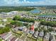 Aerial view of a community with a neighborhood lake and easy access to shops and local schools at 11438 Ivy Flower Loop, Riverview, FL 33578