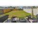 Inviting backyard patio with comfortable seating around a fire pit, perfect for outdoor gatherings and relaxation at 11438 Ivy Flower Loop, Riverview, FL 33578