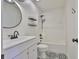 Elegant bathroom with a tub, shower, sleek fixtures, and a decorative patterned floor at 11438 Ivy Flower Loop, Riverview, FL 33578