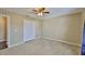 This bedroom has carpet and double doors to a closet at 11438 Ivy Flower Loop, Riverview, FL 33578