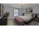 Bedroom with neutral tones, area rug, and natural light at 11438 Ivy Flower Loop, Riverview, FL 33578