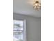 A bedroom view showcasing window, curtains, and modern light fixture at 11438 Ivy Flower Loop, Riverview, FL 33578