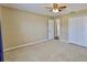 This bedroom has carpet and double doors to a closet at 11438 Ivy Flower Loop, Riverview, FL 33578