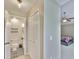 Hallway leading to bedroom and bathroom featuring closet with double doors at 11438 Ivy Flower Loop, Riverview, FL 33578