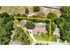 Aerial view of a home with a pool and lush landscaping, highlighted with yellow border at 11945 Darwin Ave, New Port Richey, FL 34654