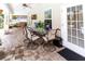 Charming outdoor living space featuring a paved patio, ceiling fan, and comfortable seating at 11945 Darwin Ave, New Port Richey, FL 34654