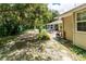 Serene backyard oasis featuring a pool, brick patio, and lush greenery for ultimate relaxation at 11945 Darwin Ave, New Port Richey, FL 34654