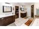 Spacious bathroom features double vanity sinks, a separate glass door shower, and a large soaking tub at 11945 Darwin Ave, New Port Richey, FL 34654