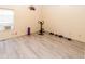 Simple exercise room features light gray flooring and exercise bike at 11945 Darwin Ave, New Port Richey, FL 34654