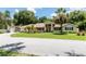 Charming home with a well-manicured front yard and inviting curb appeal at 11945 Darwin Ave, New Port Richey, FL 34654