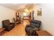 Open-concept living room featuring a cozy sitting area and dining space at 11945 Darwin Ave, New Port Richey, FL 34654