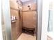 Modern shower with a built-in seat, tiled walls, and multiple showerheads for a luxurious experience at 11945 Darwin Ave, New Port Richey, FL 34654