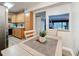 The dining area with gray countertops and light wood cabinets offers seamless flow at 1207 Pine Ridge W Cir # H2, Tarpon Springs, FL 34688