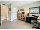 The home office features a desk, bookcase, and ample storage at 1207 Pine Ridge W Cir # H2, Tarpon Springs, FL 34688