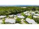 Beautiful aerial view of a home in a peaceful community near a scenic lake and lush green landscape at 123 Glendower Cir # 123, Sun City Center, FL 33573