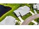 Aerial view of the home showing the roof, driveway, and landscaping at 123 Glendower Cir # 123, Sun City Center, FL 33573