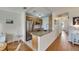 Bright kitchen featuring stainless steel appliances, granite countertops, light wood cabinetry, and wood floors at 123 Glendower Cir # 123, Sun City Center, FL 33573