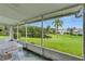 Enjoy a gorgeous view of the pond and landscaping from the screened-in patio at 123 Glendower Cir # 123, Sun City Center, FL 33573