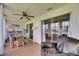 Spacious sunroom features large windows, seating, and views of the exterior landscaping at 123 Glendower Cir # 123, Sun City Center, FL 33573
