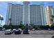 An exterior shot of this lovely highrise building with parking in front at 1230 Gulf Blvd # 601, Clearwater Beach, FL 33767