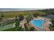 Aerial view showcasing the pool, shuffleboard, and beach access for the community at 1230 Gulf Blvd # 601, Clearwater Beach, FL 33767