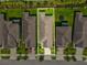 An aerial view shows the layout of this property, its neighbors, and a trampoline in the backyard at 1325 Custer Bayou St, Ruskin, FL 33570