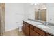 Well-lit primary bathroom featuring double sinks, granite countertops, a walk-in shower, and modern fixtures at 1325 Custer Bayou St, Ruskin, FL 33570