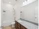 Bright bathroom featuring granite countertops, ample counter space and modern fixtures at 1325 Custer Bayou St, Ruskin, FL 33570