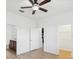 Bright bedroom with a ceiling fan, en suite bathroom and a walk-in closet at 1325 Custer Bayou St, Ruskin, FL 33570