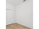 Bedroom featuring light, wood-look floors and double closet at 1325 Custer Bayou St, Ruskin, FL 33570