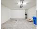 Clean garage features cement floor, with space for storage and vehicle, and roll up door at 1325 Custer Bayou St, Ruskin, FL 33570