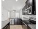 Modern kitchen featuring stainless steel appliances and granite countertops at 1325 Custer Bayou St, Ruskin, FL 33570