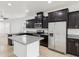 Spacious kitchen featuring a central island and stainless steel refrigerator at 1325 Custer Bayou St, Ruskin, FL 33570