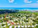 Beautiful aerial shot of the community near the water, highlighting neighborhood layout and tropical surroundings at 14230 86Th Ter, Seminole, FL 33776