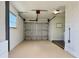 Garage area featuring a laundry area with sink, washer, dryer, and garage door at 14230 86Th Ter, Seminole, FL 33776