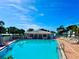 Sparkling community pool with ample lounge chairs, perfect for relaxing and enjoying the Florida sunshine at 14230 86Th Ter, Seminole, FL 33776