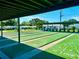 Well-maintained shuffleboard courts under a shaded area, offering a fun recreational activity at 14230 86Th Ter, Seminole, FL 33776