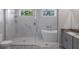 Luxurious bathroom showcasing glass shower, modern tub, and double vanity at 14422 Chamberlain Blvd, Port Charlotte, FL 33953