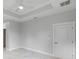 Bedroom with white tray ceiling, neutral paint, and marble flooring at 14422 Chamberlain Blvd, Port Charlotte, FL 33953