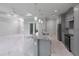 Kitchen island with marble countertop and pendant lighting in an open floor plan at 14422 Chamberlain Blvd, Port Charlotte, FL 33953
