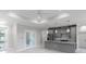 Open-concept kitchen and living area featuring modern finishes, recessed lighting, and an open floor plan at 14422 Chamberlain Blvd, Port Charlotte, FL 33953